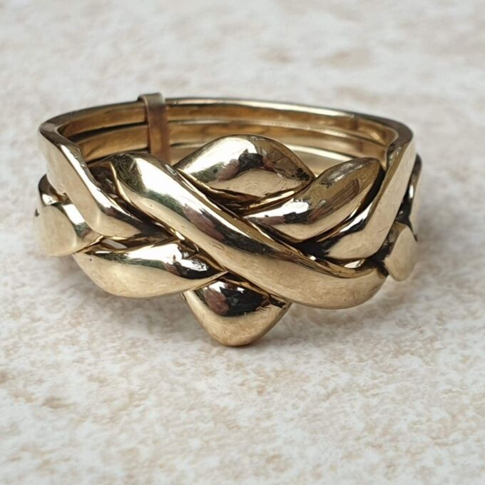 Four piece Puzzle Ring in 9ct Gold, a UK P 1/2 or a US 8. Gems Afire