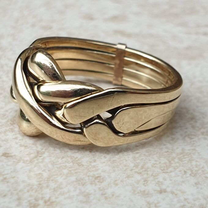 Four piece Puzzle Ring in 9ct Gold, a UK P 1/2 or a US 8. Gems Afire